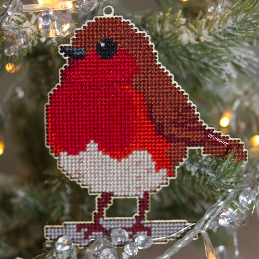 Image of a Robin Redbreast template in wood and completed with cross stitch embroidery