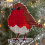 Image of a Robin Redbreast template in wood and completed with cross stitch embroidery