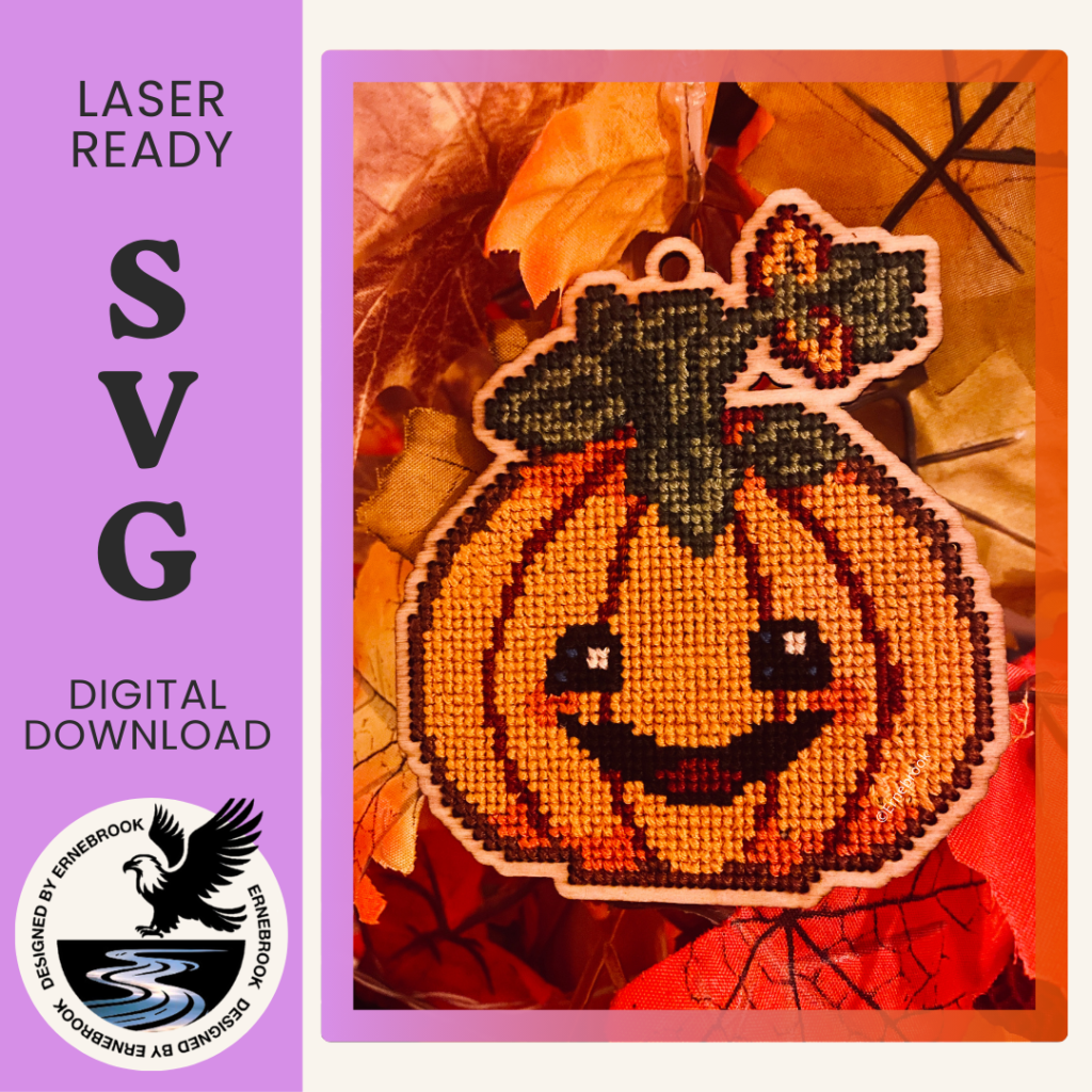 Image of a festive pumpkin template in wood and completed with cross stitch embroidery