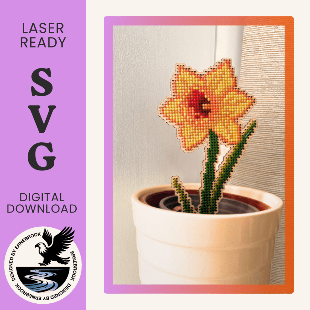 Image of a single daffodil template in wood and completed with cross stitch embroidery in a cream pot. To the left is a purple panel with the words Laser-ready SVG digital download with the logo of Ernebrook Designs of an Eagle flying above a brook.