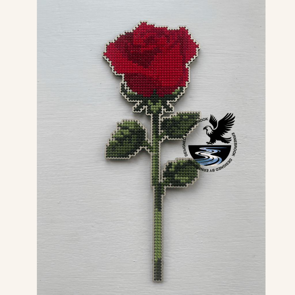 An elegant cross-stitch home decoration. Cut out of 3mm plywood with a cross-stitch design embroidered.